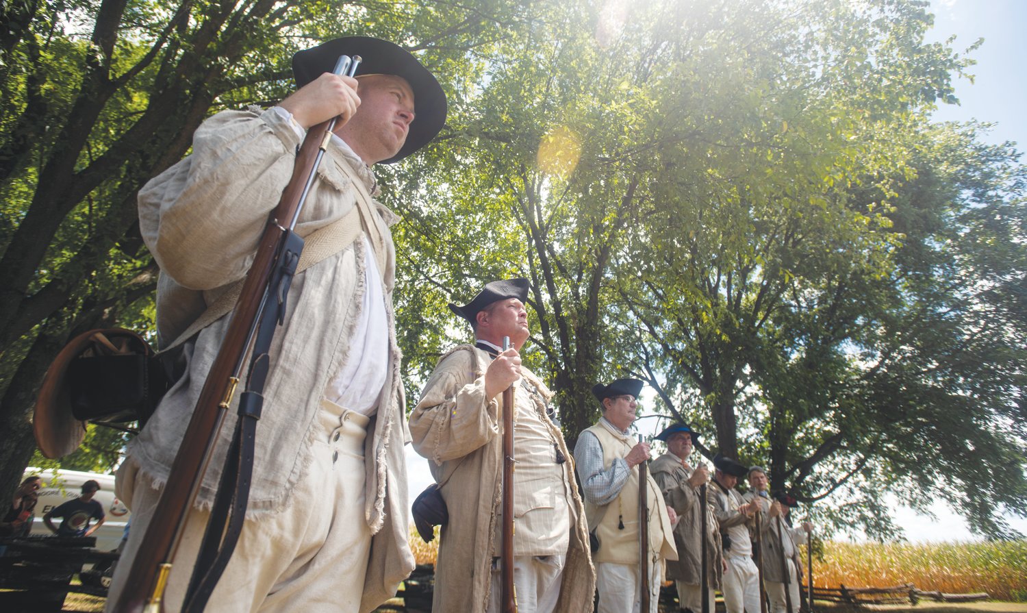 AJ Drake, left, stands in formation before he and other reenactors fire duplicates of Revolutionary War-era firearms. Last Saturday saw a retelling of the 1781 battle at the Alston House, also known as the House in the Horseshoe, in Sanford.