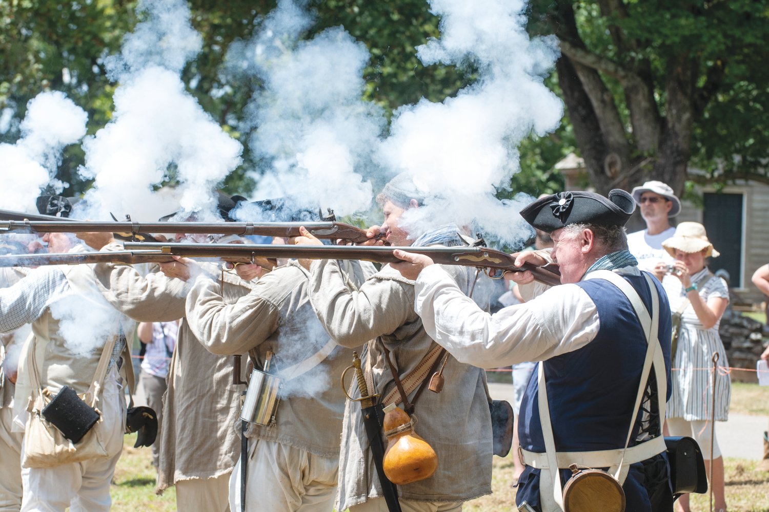 Smoke from musket powder billows as reenactors fire during Saturday's battle at the House in the Horseshoe.
