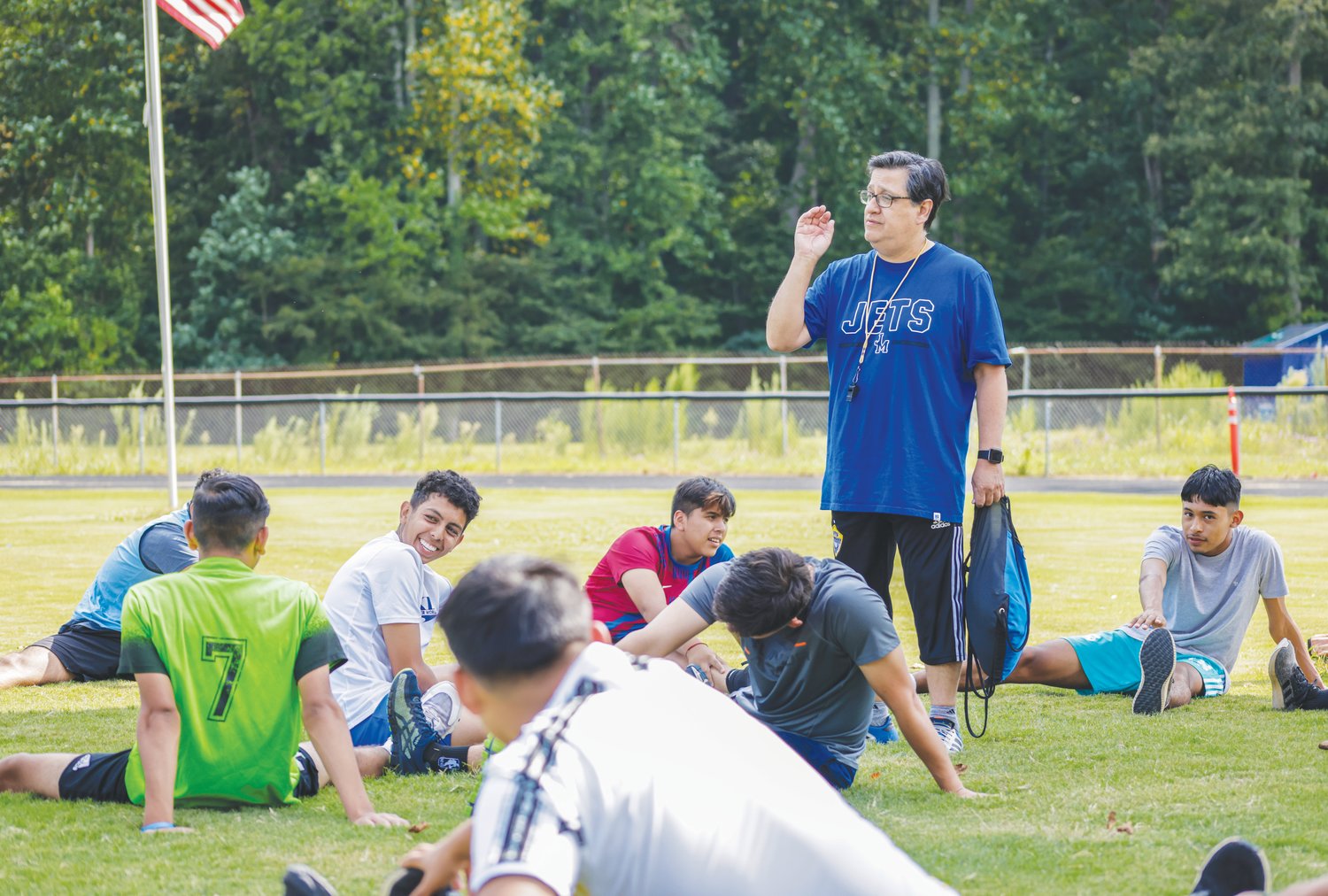 Jordan-Matthews head soccer coach Paul Cuadros gives instruction to his team during a workout.