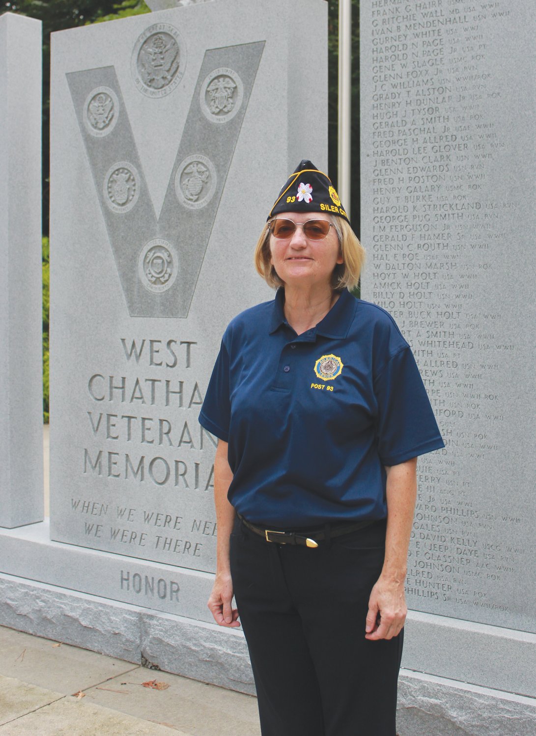 American Legion Post 93 Commander Carin O’Brien poses for a portrait next to the West Chatham Veterans Memorial at Bray Park in Siler City. O’Brien is the first female commander for Post 93.