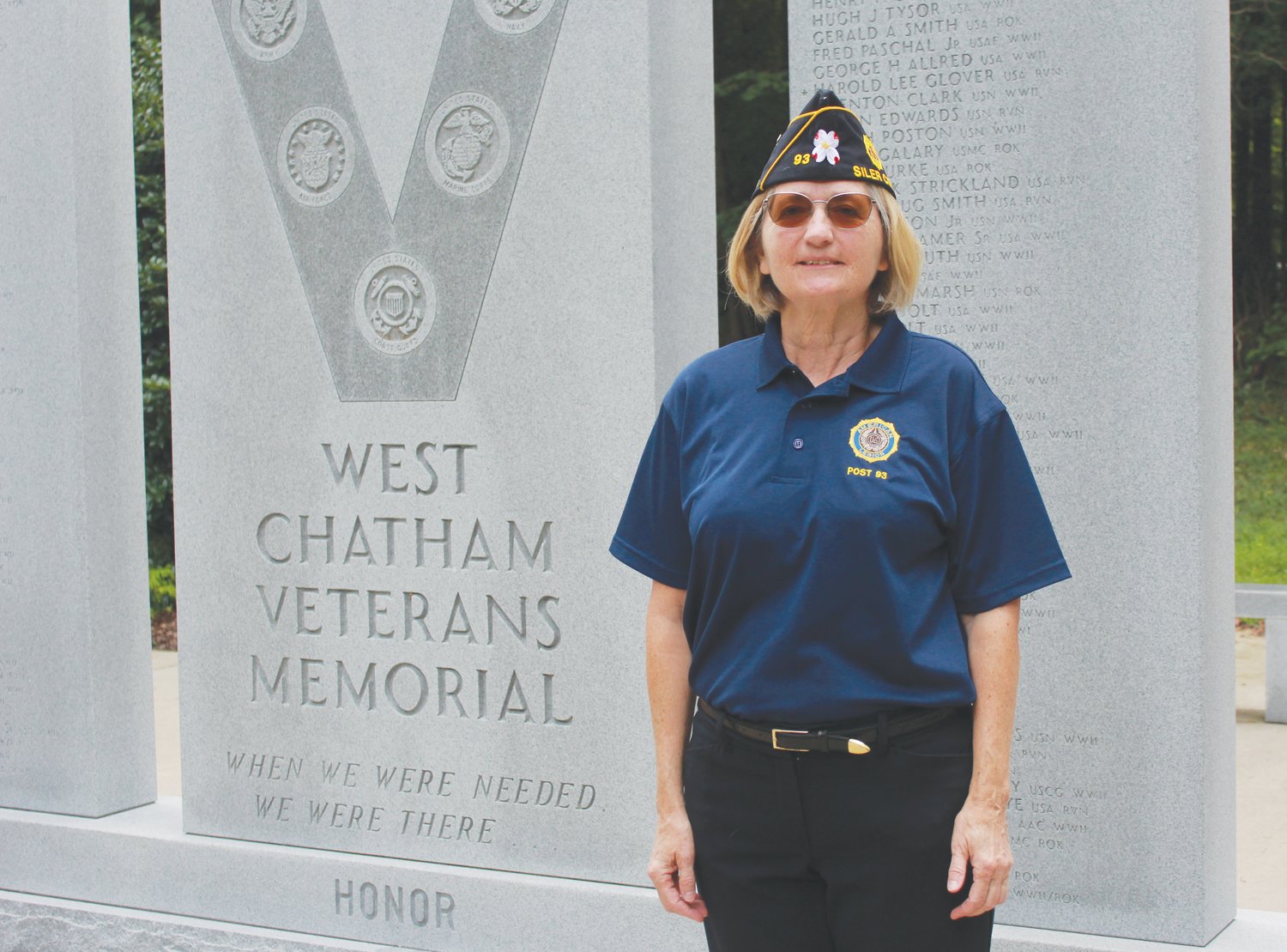 American Legion Post 93 Commander Carin O’Brien poses for a portrait next to the West Chatham Veterans Memorial at Bray Park in Siler City. O’Brien is the first female commander for Post 93. This year, Post 93 will be celebrating its 100th anniversary as an organization for veterans.